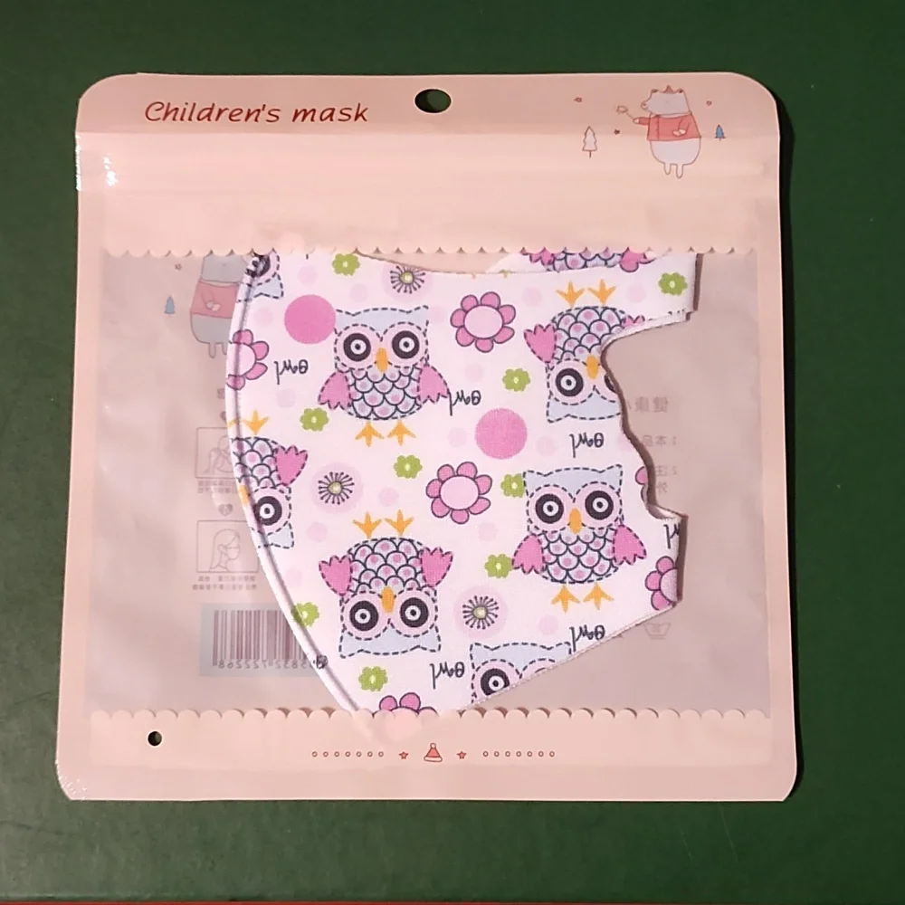 Children's re Usable face mask new in package never opened